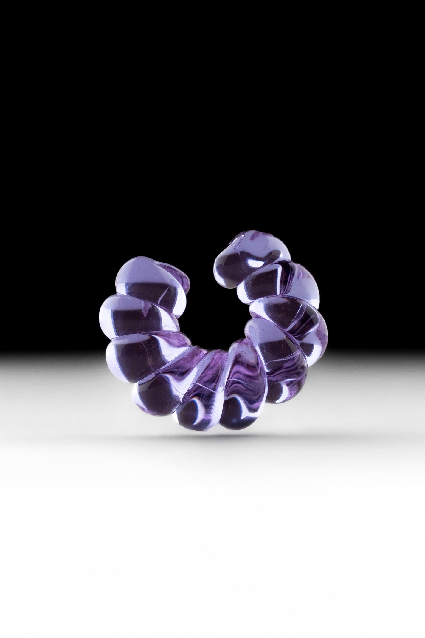 Single-piece borosilicate glass ear cuff in purple.