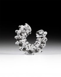 Handmade transparent borosilicate glass ear cuff, decorated with small spheres and dots, fits securely without a piercing.