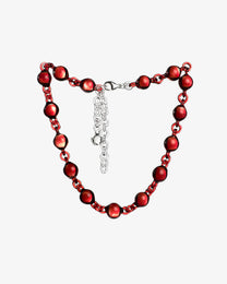 Red Orb Necklace made from solid borosilicate glass spheres connected by matching red glass links, handmade jewelry design.