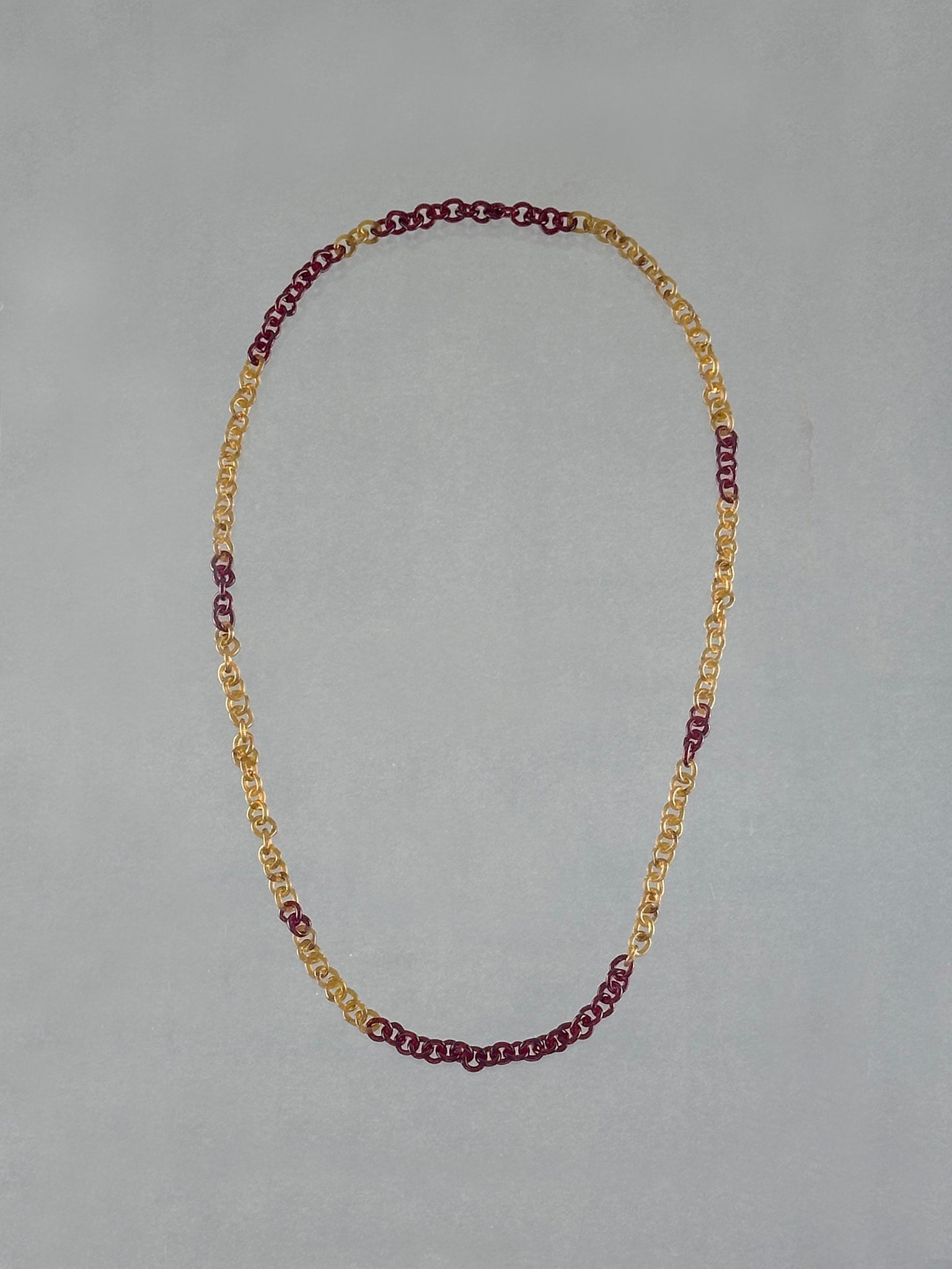 Unique handmade Sequence Necklace crafted from borosilicate glass links in warm amber and red tones. A lightweight 75 cm rope-style necklace.