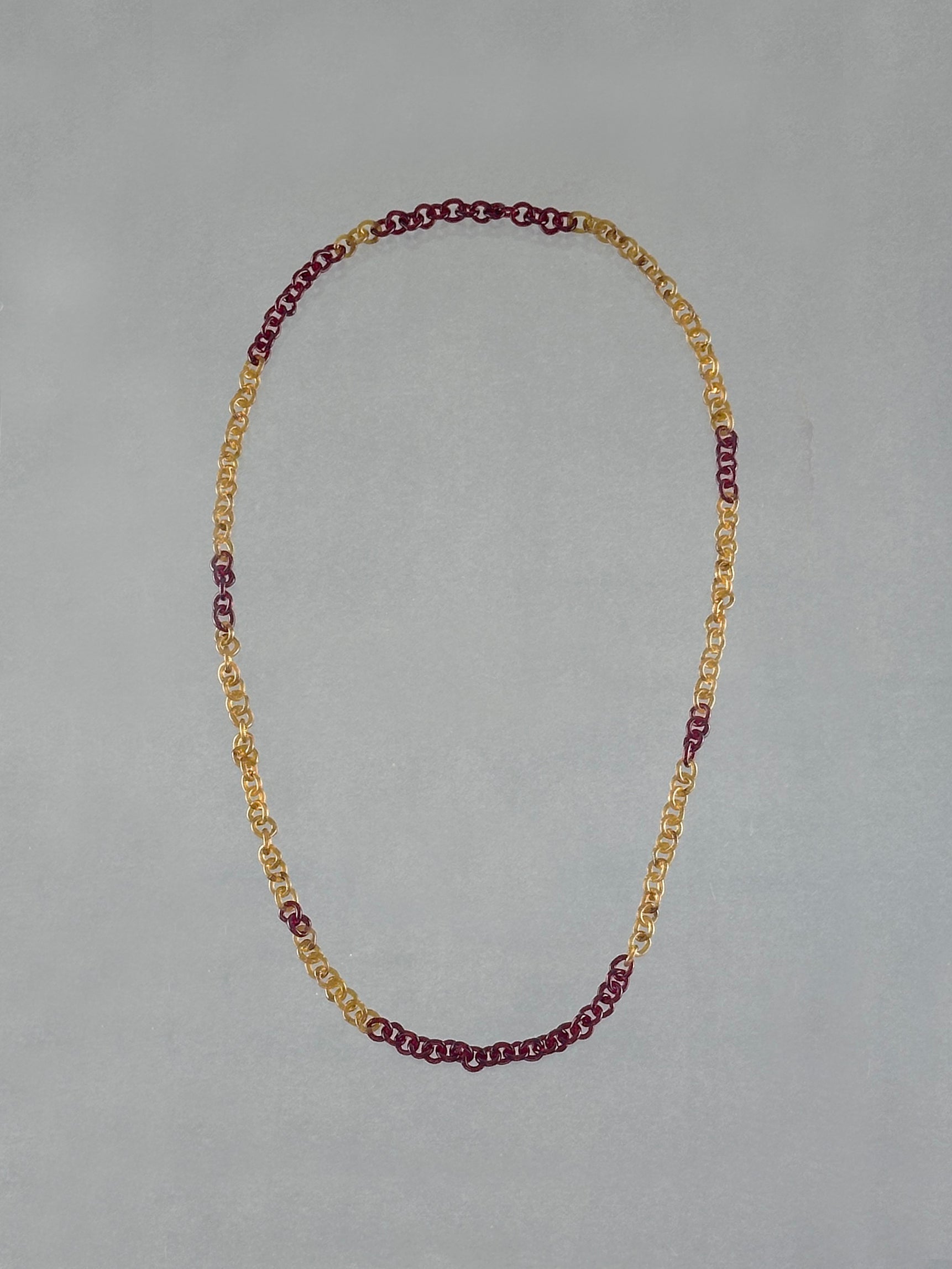 Unique handmade Sequence Necklace crafted from borosilicate glass links in warm amber and red tones. A lightweight 75 cm rope-style necklace.