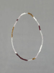 Handmade Sequence Necklace featuring borosilicate glass links in amber, red, pink, white and transparent glass. A unique 75 cm necklace.