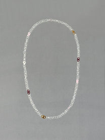 Unique handmade Sequence Necklace crafted from borosilicate glass in amber, red, pink, opaque pink, white and transparent tones.