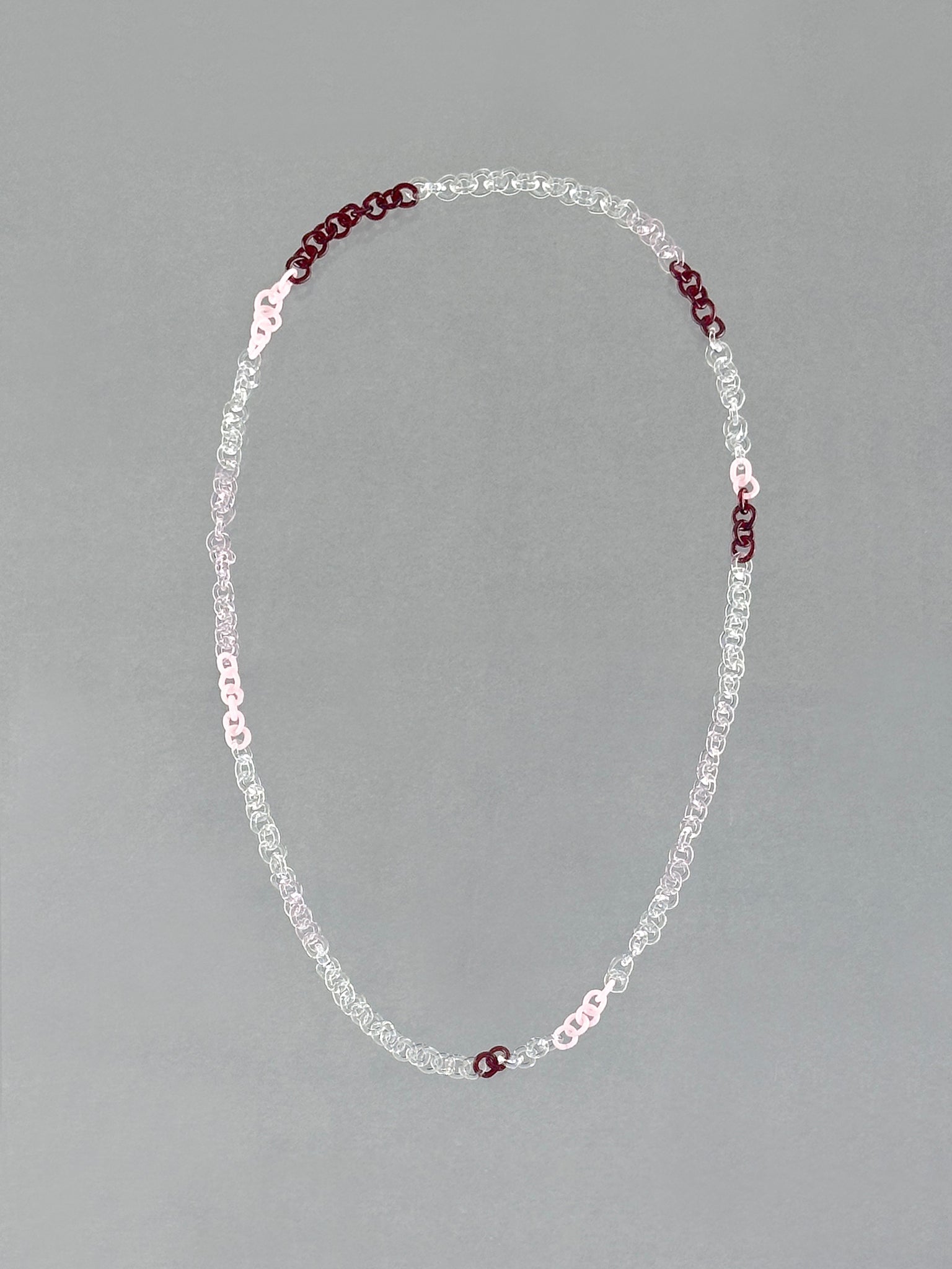 Unique borosilicate glass Sequence Necklace handmade with red, pink, opaque pink, white and transparent glass links.
