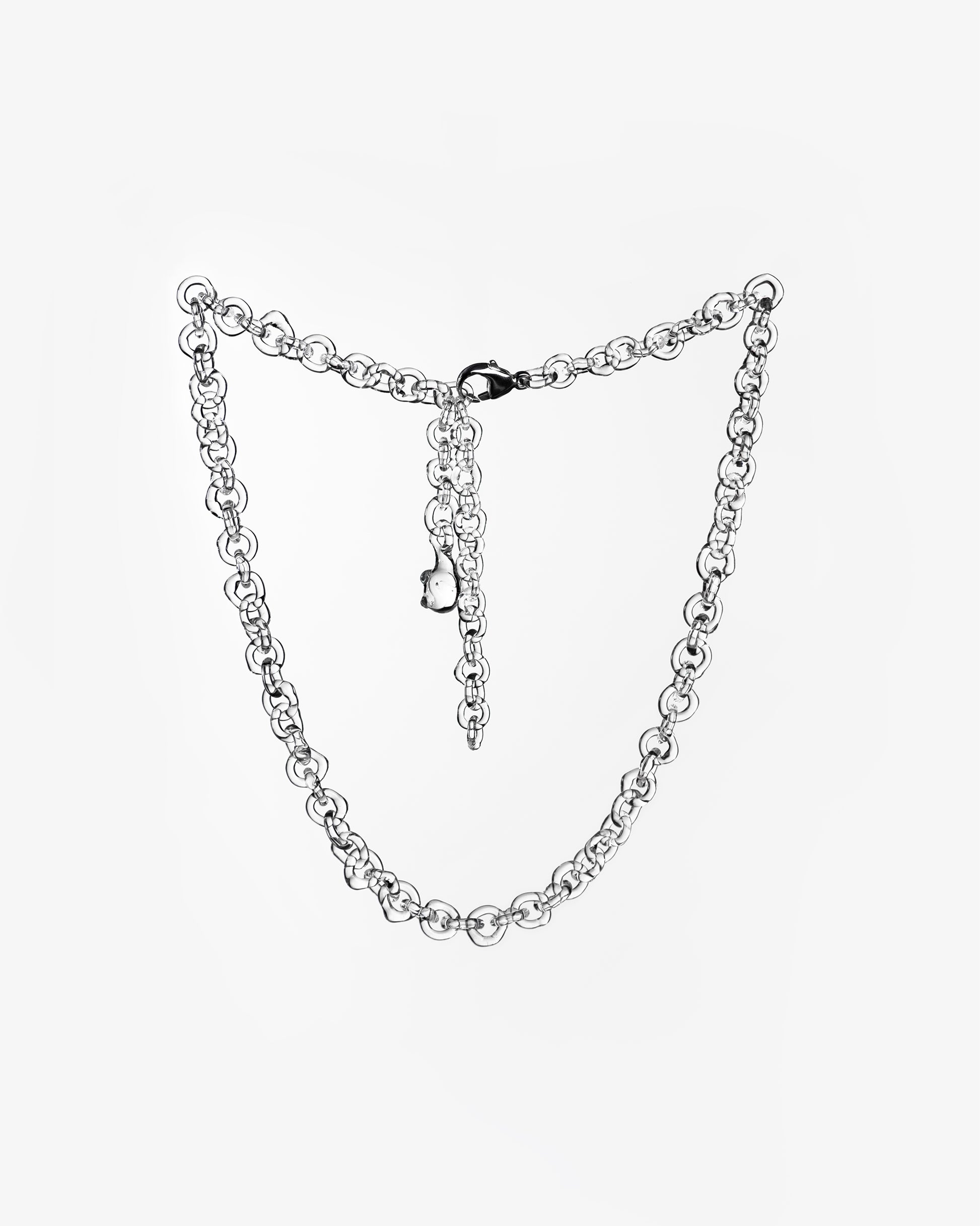 Thin glass chain necklace made from transparent borosilicate glass links, with sterling silver clasp.