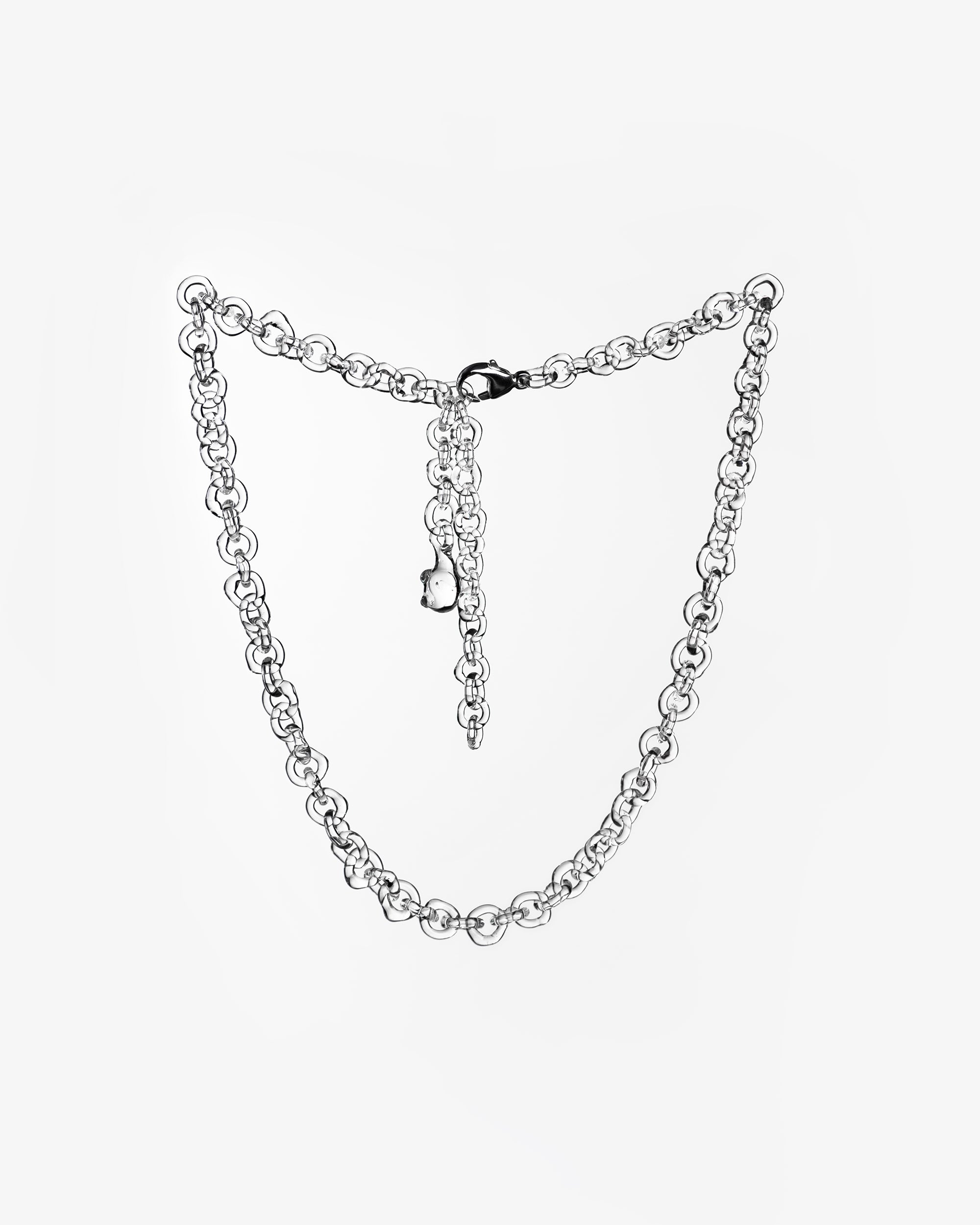 Thin glass chain necklace made from transparent borosilicate glass links, with sterling silver clasp.